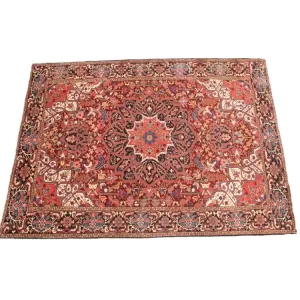 Luxurious handmade Heriz rug featuring rich colors and detailed motifs