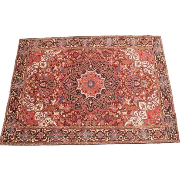 Luxurious handmade Heriz rug featuring rich colors and detailed motifs