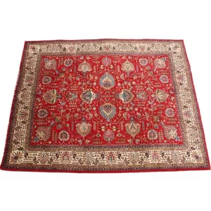 Handmade Tabriz rug with intricate border patterns