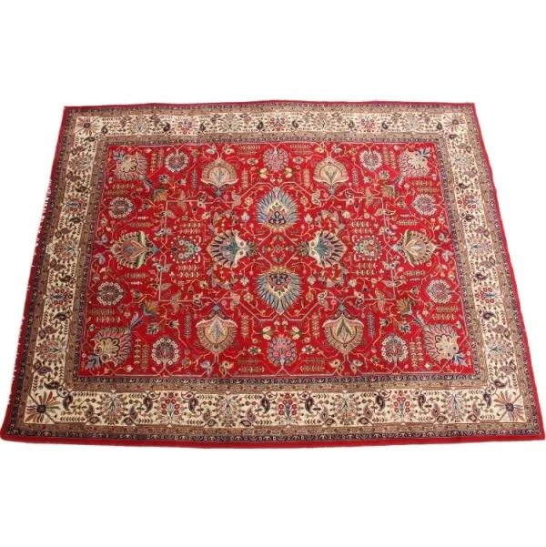 Handmade Tabriz rug with intricate border patterns