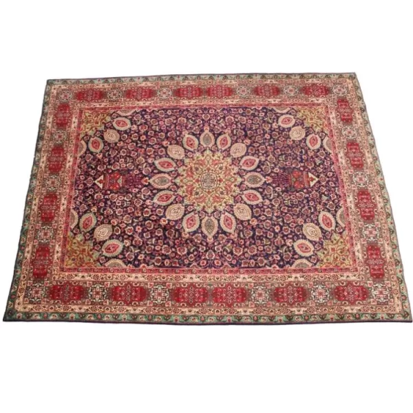 Intricately patterned Persian Tabriz carpet with floral motifs