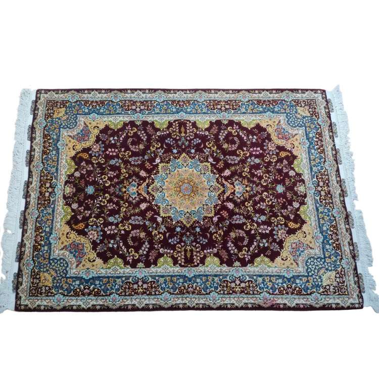 Handmade Persian Tabriz Carpet with intricate designs and rich colors.