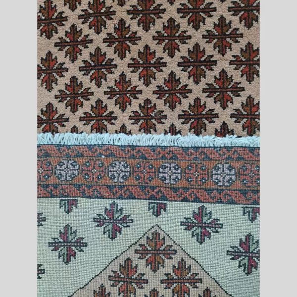 Close-up view showing the knots count and weaving style of the handmade Persian Baluch runner.