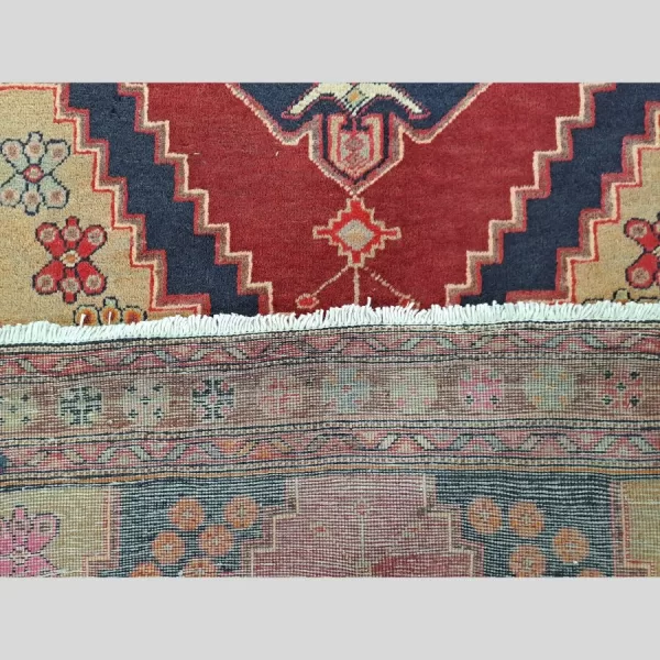 Detailed view of the knot count and weaving style of the Persian Afshar runner.