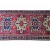 Close-up of the rich textures and colors on the Persian runner.