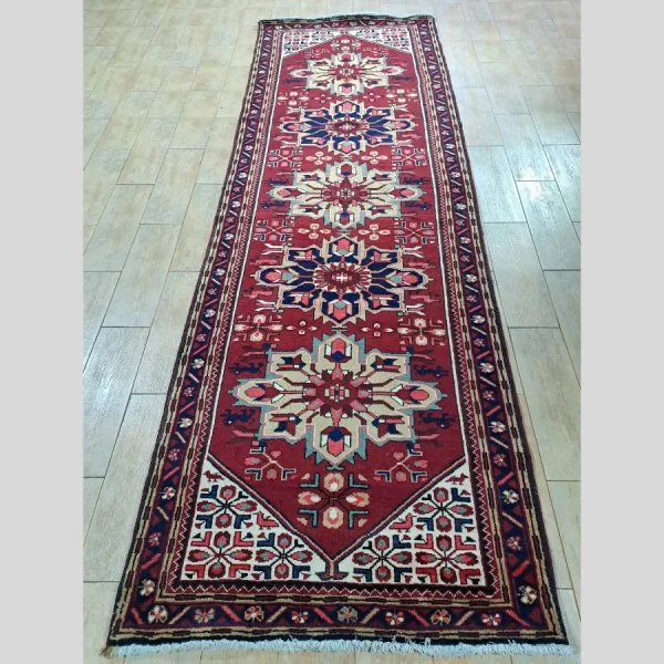 Full view of a handmade Persian runner featuring traditional geometric patterns.